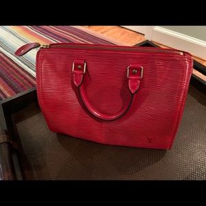 Louis Vuitton red epi leather speedy bag 25; barely used. Like new! Gorgeous.